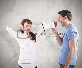 Composite image of man shouting through a megaphone
