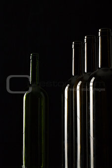 Silhouettes of elegant wine bottles