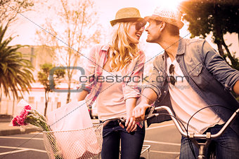 Hip young couple on a bike ride