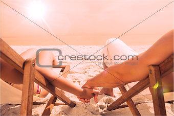 Couple resting on deck chairs