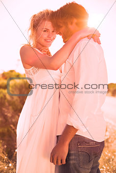 Attractive couple embracing by the road