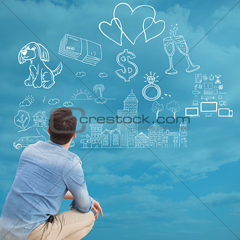 Composite image of casual man looking up