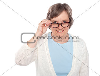 Attractive female holding her eyeglasses