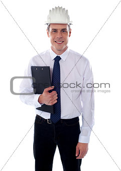 Young architect holding clipboard