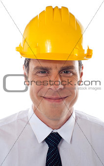 An architect wearing yellow safety helmet