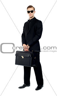 Full length portrait of handsome male with briefcase