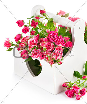 bouquet pink roses in wooden basket