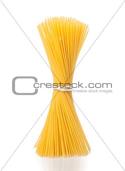 bunch of raw pasta spaghetti on white background