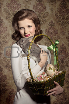 woman with rabbit and easter eggs 