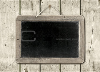 Blackboard on a white wood wall background