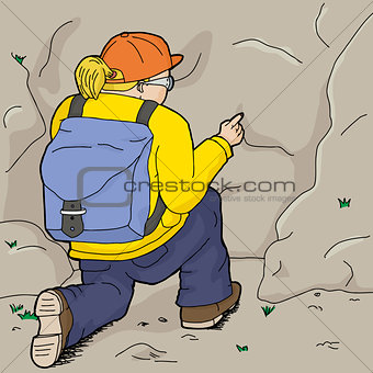 Female Hiker Points at Rock