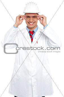 Smiling architect holding eyeglasses