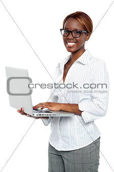 Female executive typing on laptop and working