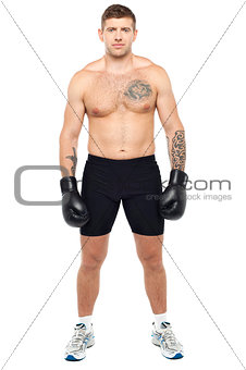 Full length picture of young muscular boxer