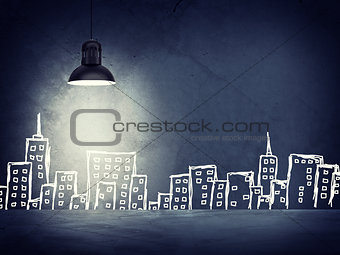 Concrete wall with sketches of buildings. Left standing lampshade