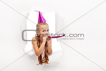 Little party girl with hat and whistle