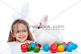 Happy little girl with her easter bunny