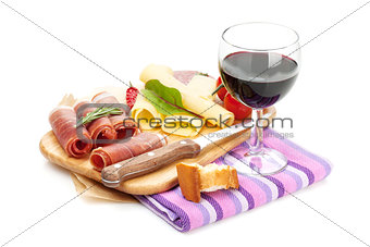 Red wine with cheese, prosciutto, bread, vegetables and spices