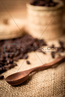pile of fresh and bio aromatic coffee beans and spoon