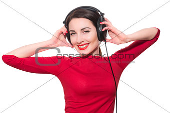 Wonderful teenager girl  listening to the music in big headphone