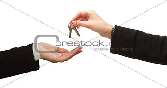 Woman Handing Over Woman Set Of Keys Isolated on White