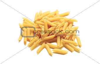 Raw italian penne rigate pasta isolated on white background