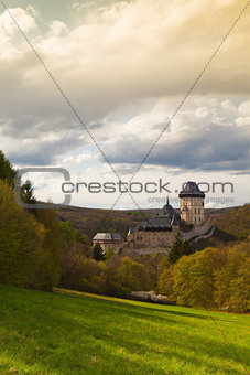 Famous Karlstejn castle  in autumn forest,Czech Republic
