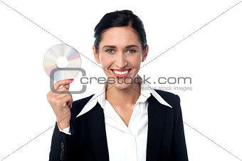 Business woman holding compact disc