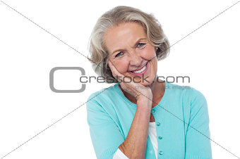 Shy and polite senior smiling woman