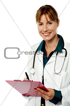 Isolated lady doctor writing prescription