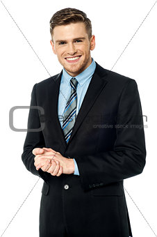 Corporate guy posing with clasped hands