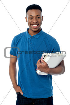 College student holding notebooks