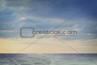 Concrete floor on background of clouds