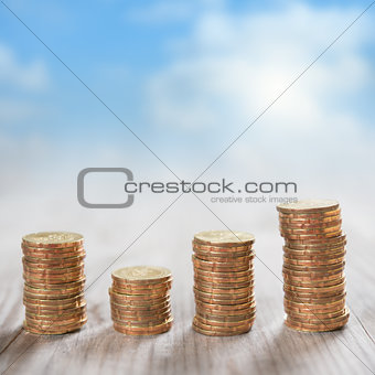 Stack coins with sky background