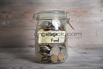 Coins in jar with college fund label