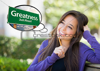 Young Woman with Thought Bubble of Greatness Green Road Sign 