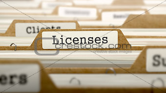 Licenses Concept with Word on Folder.