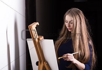 Woman and easel. 