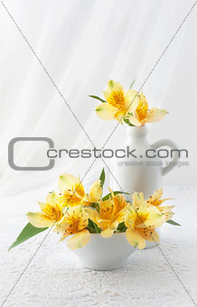 Bouquet of flowers on a white lace tablecloth