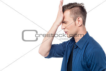 Casual man with hand on head