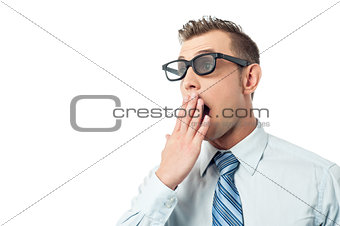 Young businessman, hand on mouth