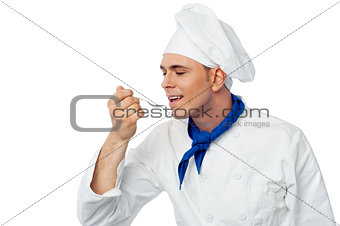 Male chef tasting the food