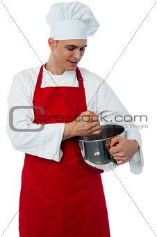 Male chef with whisk and mixing bowl