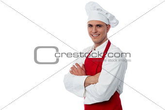 Smiling male chef on a white background