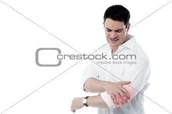 Man has pain in the elbow