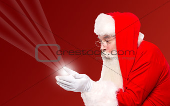 Santa holding magical lights in hands