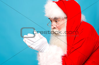 Santaclaus about to blow snow