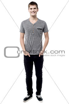 Casual man posing with hands in pockets