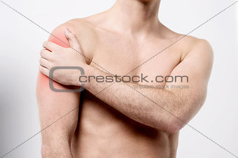 Muscular man discomfort on shoulder