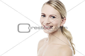 Smiling woman posing over white